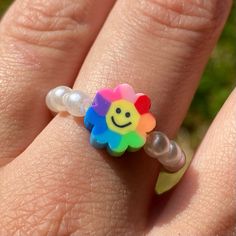 Kidcore Rainbow Smiley Flower Faux Pearl Handmade Jewelry Stretch Ring The Cutest Kidcore Rainbow Smiley Face Flower Faux Pearl Stretch Ring Handmade By Me. -Features Faux Pearl And Polymer Clay Beads. - Stretches To Fit Most Fingers Brand New. Comes From A Smoke Free Home. Kidcore Accessories, Kidcore Rainbow, Kidcore Jewelry, Mcu Shifting, Qi Rong, Rainbow Smiley Face, Decora Fashion, Smiley Flower, Abbott Elementary