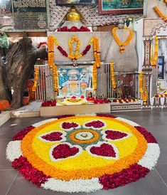 a decorated floor with flowers and candles