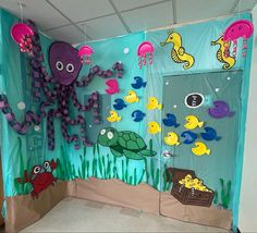 an octopus and other sea animals are on display in a classroom setting with paper cutouts