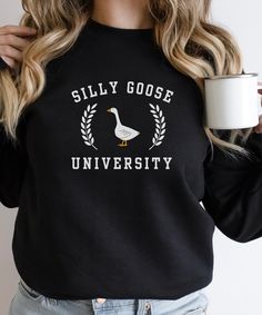 🦢 Introducing our Silly Goose University Crewneck Sweatshirt - a whimsical and playful addition to your wardrobe that's sure to put a smile on your face. This charming design captures the essence of fun and laughter, making it a must-have for those who love a touch of whimsy in their style. 🌈 Pair the Silly Goose University Crewneck Sweatshirt with your favorite jeans, leggings, or a skirt for a look that's as charming as it is comfortable. It's versatile enough to wear year-round. 🎁Looking for a unique gift idea? The Silly Goose University Crewneck Sweatshirt makes a delightful present for friends and loved ones who appreciate humor and style. 👕 Our Silly Goose University Crewneck Sweatshirt features: Ideal for any situation, a unisex heavy blend crewneck sweatshirt is pure comfort. T Novelty Cotton Crew Neck Sweatshirt, Funny Crew Neck Sweatshirt With Print, Funny Crew Neck Sweatshirt With Screen Print, Funny Text Crew Neck T-shirt For College, Funny Crew Neck T-shirt For College, Funny Crew Neck Tops For College, Silly Goose University, Gift For Guys, Funny Goose