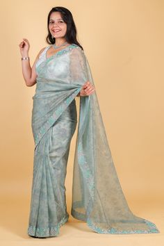 Indulge in luxury with our Net Saree in a stunning blue color, featuring intricate print, swarovski, and sequin work. This exquisite piece exudes elegance and exclusivity, perfect for special occasions. Elevate your style with the finest craftsmanship and design. Net saree with print, swarosvki and sequin work - blue color Saree comes with a blouse piece. Fall and pico done. Fully stitched blouse shown in pictures is optional and can be purchased seperately from our blouses and croptops section. For saree video please connect with us on whatsapp @469-937-0606 Ready to be shipped in USA from San Diego, California. All pictures are original pictures. Colors may slightly vary due to pic resolution. Blue Color Saree, Net Saree, San Diego California, Blouse Piece, Labour Day, San Diego, Light Pink, Special Occasion, Sequin