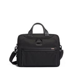 This larger, hardworking briefcase has the space and a place for everything. A padded laptop section fits screens up to 15�� and the second section is open, keeping it completely versatile. The exterior has a front U-zip pocket that opens fully for easy access to smaller pockets perfect for media devices and accessories. A magnetic slip pocket lets you easily stow and access your phone. Part of our Alpha 3 Collection, iconic business and travel pieces that bring together innovative design, super Tumi Briefcase, Tumi Bags, I Am Coming, Packing For Travel, Intuitive Design, Sac Lunch, Laptop Briefcase, Work Bag, Computer Bags