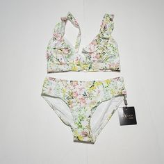 Niptuck Botanical Floral Two-Piece Bikini Swimsuit High-Waist Bottom Ruffle Detail On Top By Bust Multi-Color: White Background, With Greens, Pinks, Yellows Size: 4 Measurements Top Band: 25" Cup: 6" Strap Length: 10 1/2" Bottom Waist: 13 1/4" (27 3/4" All The Way Around) Rise: 11" (From Front Top Seam To Seam Through Back Of Crotch Seam) Bottom Length: 8 1/2 (From Back Top Seam To Seam At Crotch Seam) Condition: Brand New -Hygienic Protection In Suit Spring Tankini For Pool With Lined Body, Spring High Waist Swimwear For Beach, High Waist Swimwear For Spring Beach, Lined Tankini For Summer, Spring High Waist Beach Swimwear, Feminine Sleeveless Swimwear For Summer, High Waist Floral Print Swimwear For Sunbathing, Feminine Beach Swimwear With Lined Body, Spring Vacation Tankini With Lined Body