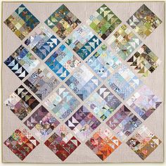 a quilt made with many different colored squares