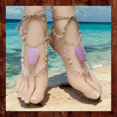 These handmade barefoot sandals are truly one of a kind! They are made from soft, natural hemp knotted with frosted quartz gemstone beads, crystal beads, and gold-colored metal beads. The centerpiece ornaments are made with frosted lavender glass. The toe strap and ankle ties are braided for extra durability. These sandals have long 20-inch long ties with beads at the ends. The ties wrap around the ankle and can be adjusted to fit all adult sizes. These woven barefoot sandals are one-of-a kind a Handmade Bohemian Sandals For Beach Wedding, Bohemian Handmade Sandals For Beach Wedding, Handmade Bohemian Barefoot Sandals For Beach Wedding, Bohemian Barefoot Sandals For Beach Wedding, Handmade Adjustable Barefoot Sandals For Beach Wedding, Adjustable Sandals For Beach Party, Bohemian Adjustable Sandals For Beach Wedding, Adjustable Sandals For Beach Party Season, Handmade Open Toe Barefoot Sandals For Beach