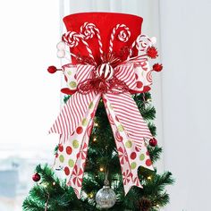 a decorated christmas tree with candy canes and bows