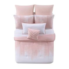 a pink and white bed with two pillows