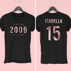 two t - shirts with the same number on them, one is black and the other is pink