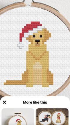 a cross stitch pattern with a dog wearing a santa hat