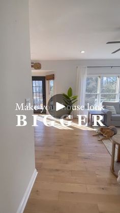 an empty living room with hard wood floors and white walls is featured in this video