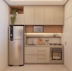 a small kitchen with stainless steel appliances and white cupboards is shown in this rendering