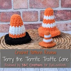 two crochet traffic cones sitting on top of a wicker basket