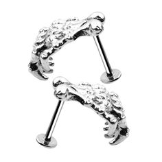 PRICES MAY VARY. Material: Stainless Steel and Alloy Color : Silver Size: About 12.8 x 11 mm（0.5 x 0.43inch） Gauge: 16G (1.2mm thickness) Beautiful And Fashion Design Lip Stud Body Piercing Jewelry Description: - Material: Stainless Steel and Alloy
 - Color : Silver
 - Size: About 12.8 x 11 mm（0.5 x 0.43inch）
 - Gauge: 16G (1.2mm thickness)
 - Beautiful And Fashion Design Lip Stud Body Piercing JewelryPackage Includes:1 Pair Lip StudsNote:Since the size above is measured by hand, the size of the Punk Piercings, Labret Ring, Labret Jewelry, Lip Stud, Tragus Stud, Cartilage Stud, Skeleton Skull, Skull Hand, Body Jewelry Piercing