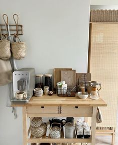 a wooden table topped with lots of baskets