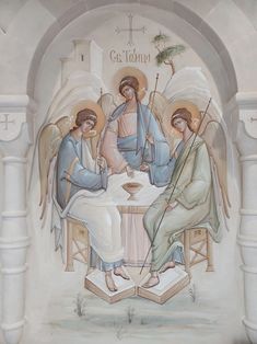 an image of three angels sitting at a table