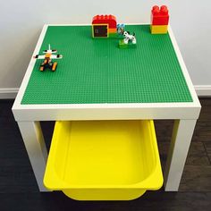 a table with legos on it in the middle of a room