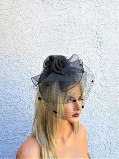 Black crinoline fascinator with feathers black pearls and netting Attaches with a long clip You will receive the hat in the mail 4-5 business days after purchase Tulle Fascinator For Kentucky Derby Evening, Tulle Fascinator For Kentucky Derby Party, Tulle Fascinator For Evening And Kentucky Derby, Kentucky Derby Evening Tulle Headpiece, Evening Tulle Headpiece For Kentucky Derby, Elegant Black Mini Hat For Halloween, Elegant Black Halloween Mini Hats, Black Fascinator Hat For Halloween, Black Halloween Fascinator Hat