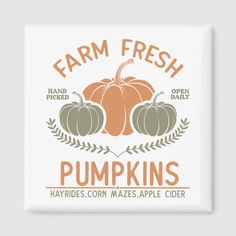 the farm fresh pumpkins logo is shown on a white square tile wall mounted plaque