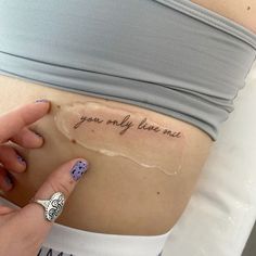 a woman's stomach with the words you only have one written on her belly