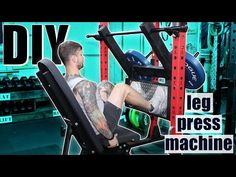 a man sitting on top of a bench in a gym with the words diy leg press machine