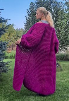 Indulge in the warmth and style of our extra-long mohair chunky knit cardigan, featuring a vibrant fuchsia color perfect for cool days and evenings. This cozy garment goes beyond being just clothing; it's a mood. Versatile enough to be paired with jeans, dresses, or shorts for any occasion, it effortlessly complements your entire wardrobe, ensuring you look stylish wherever you go. Embrace the comfort of wearing it at home as cozy loungewear. Not just a piece of clothing, this cardigan makes for Hand Knitted Long Cardigan, Extra Long Cardigan, Fluffy Cardigan, Cardigan Knitted, Maxi Cardigan, Cozy Loungewear, Mohair Cardigan, Chunky Knit Cardigan, Cardigan Long