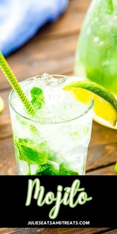 mojito cocktail with lime and mint on wooden table next to lemon wedges