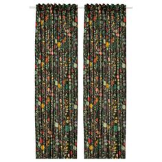 the curtains are decorated with colorful flowers and leaves on black fabric, which is hung in front of a white wall