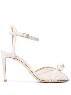 Ivory white lace and leather Sacora 85mm pearl-embellished sandals from Jimmy Choo featuring an open toe, a round toe, an ankle strap with a side buckle fastening, a branded insole and a pearl embellishment. | Jimmy Choo Sacora 85mm pearl-embellished sandals Jimmy Choo Sacora, Chinoiserie Wedding, Pearl Embellishment, Jimmy Choo Sandals, Childhood Dream, Lace Pumps, Stirrup Leathers, Bridal Sandals, Victorian Wedding