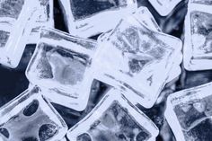 many ice cubes are shown in black and white colors, as if they were frozen or melting