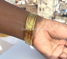 Hammered Bangles Gold Plated bangles 7 Day bangles Stacking bangles Brass bangles Set of 7 bangles Gold Plated For Woman Gift for Her Material : Brass Bracelet Size Inches Circumference/Diameter 7 / 2.23 7.5 / 2.39 8 / 2.55 8.5 / 2.71 9 / 2.87 9.5 / 3 How To Measure Your Wrist Size: Open up your palm to widen your wrist. Place the metal end of tailor's tape in the center of your wrist. Pull the tape over your wrist to where it fits snug. Line up the tape with the metal end piece and read the mea Festival Stackable Bangles, Festival Stackable Bangle, Stacking Bangles, Handmade Wedding Gifts, Hammered Bangles, Bangles Gold, Bangles Set, Brass Bangle, Gold Plated Bangles