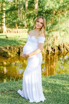 Summer maternity shoot! This white Short-Sleeve Off the Shoulder Sweetheart Maternity Gown is the perfect photoshoot, baby shower, or special event. With a cross over sweetheart bust, a slim fit bodice, a simple flare, and ultra-soft, stretch material this gown is equal parts comfort and elegance.  #maternitygown #maternityphotos #photoshoot #whitegown #summerphotos #summer #prettymama #momtobe #pregnant Fitted Off-shoulder Maternity Dress For Wedding, Fitted White Maxi Dress For Maternity Wear, Maternity Fitted Gown With Sweetheart Neckline, Maternity Gown With Sweetheart Neckline, Maternity Wedding Dress With Sweetheart Neckline, Fitted Maternity Gown With Sweetheart Neckline, White Fitted Maternity Maxi Dress, White Fitted Maxi Dress For Maternity, Fitted Empire Waist Maternity Dress For Wedding