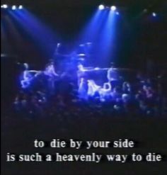 an image of a band on stage with the words to die by your side is such a heavenly way to die