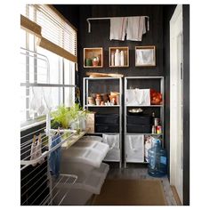 an open refrigerator in a kitchen next to a window