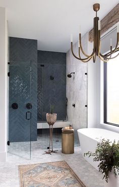 a bathroom with a tub, shower and rug