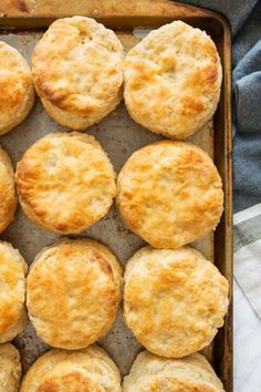 buttermilk biscuits in a baking pan with text overlay