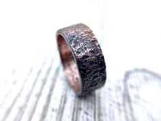 "Elevate your style with our Hand-Forged Copper Ring, a rustic and unique statement piece that exudes timeless charm. Crafted with precision and passion, this ring embodies the artistry of skilled artisans. Each ring is meticulously forged from high-quality copper, ensuring durability and longevity. Its rustic finish adds character and individuality, making it a standout accessory for those who appreciate distinctive craftsmanship. The warm, earthy tones of copper make this ring a versatile addition to any wardrobe. Whether you're dressing up for a special occasion or adding a touch of elegance to your everyday look, this copper ring complements a wide range of styles. Its comfortable fit ensures that you can wear it all day, while the hand-forged design guarantees that no two rings are ex Rustic Hand Forged Promise Ring, Rustic Brown Hammered Jewelry, Luxury Artisan Copper Jewelry, Rustic Hand Forged Ring Jewelry, Rustic Copper Jewelry With Natural Stones, Unique Handmade Copper Rings, Handmade Copper Artisan Ring, Rustic Rust Jewelry With Patina, Unique Silver-colored Copper Ring