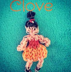 a crocheted doll laying on top of a blue carpet with the words clove written above it