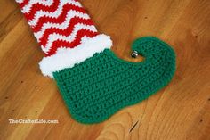 a crocheted christmas stocking on the floor