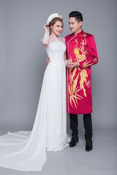 a young man and woman dressed in traditional chinese wedding attire standing next to each other