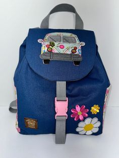 This stylish backpack purse is handmade with a denim outer layer, heavy duty interfacing, and a  cotton liner. The adjustable straps are 1 inch cotton webbing. The purse can be worn as a backpack or over one shoulder. The flap covers a drawstring closure, and is held securely in place with a quick release slide buckle. There  are two pockets inside. The side pockets are perfect for a cell phone, sunglasses, or even a small water bottle. This backpack is roomy enough for purse essentials plus a f Blue School Backpack With Adjustable Straps, Casual Blue Backpack For Adventure, Adjustable Blue School Bag, Adjustable Blue School Backpack, Adjustable Blue School Bags, Blue Canvas Backpack With Adjustable Strap, Casual Blue Adventure Backpack, Denim Blue Backpack With Zipper Closure, Blue Backpack With Zipper Closure