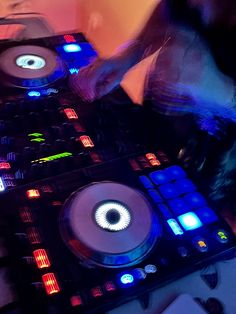 a dj mixing some music on his turntables