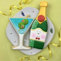 a plate with a bottle and a glass on it next to a yellow ribbon that says happy new year