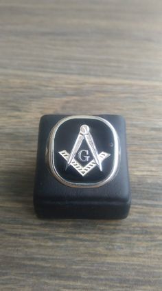 MASONIC SILVER 925 RING Mens Masonic Ring Handmade Freemasonry Enamel can be done in the colour you want. METAL-silver 925 Each ring is sealed on the purity of the metal to 925 All creations are specially designed, hand cast of solid silver, and individually polished Made entirely in GREECE It comes with a beautiful gift box Black Symbolic Hallmarked Signet Ring, Symbolic Black Engraved Hallmarked Ring, Masonic Ring, Ring Mens, 925 Ring, Silver Rings Handmade, Hand Cast, Beautiful Gift Boxes, 925 Silver Rings