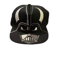 a darth vader baseball cap with an image of the helmet on it's side