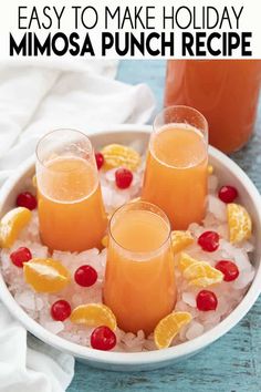 three glasses filled with orange juice on top of ice