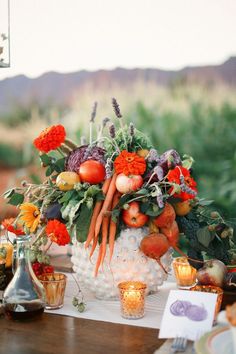 a table topped with lots of different types of flowers