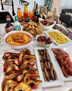 a table filled with plates and bowls of food