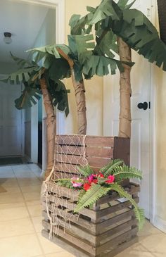 a planter made out of wooden pallets and palm trees