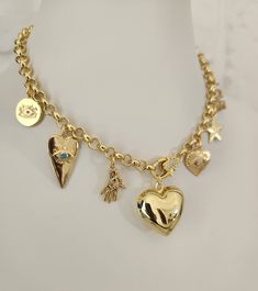 Discover charm and protection in one accessory with our exclusive multi-charm necklace! This unique piece combines a puffed heart and evil eye charms, creating a perfect balance between sweetness and mysticism.  Product description:  Material: High quality chain, gold plated for an elegant and durable finish.  Charms: Inflated heart and evil eyes to protect you from bad energies. Length: Adjustable to comfortably fit any style.  Style: Versatile for any occasion, from everyday to special events. Chunky Charm Necklace, Charms Necklaces, Meaningful Gifts For Her, Evil Eyes, Puffed Heart, Protection Necklace, Gold Heart Necklace, Pretty Jewelry, Jewelry Making Tutorials