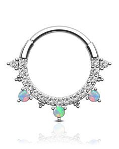 an opal piercing ring with three stones in the middle and two smaller opals on each end